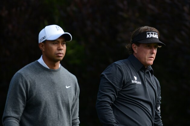 SAN FRANCISCO, CA - JUNE 14:   Tiger Woods (L) and Phil Mickelson wait on the 13th tee during the first round of the 112th U.S. Open at The Olympic Club on June 14, 2012 in San Francisco, California.  (Photo by Harry How/Getty Images)