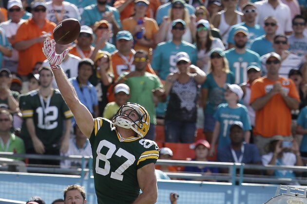 Green Bay Packers wide receiver Jordy Nelson (87) reached for a pass as Miami Dolphins cornerback Brent Grimes (21) defends, during the second half of an NFL football game, Sunday, Oct. 12, 2014, in Miami Gardens, Fla. (AP Photo/Lynne Sladky)