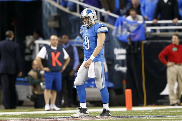 Detroit Lions quarterback Matthew Stafford (9) walks off the field after being intercepted by Baltimore Ravens free safety Matt Elam in the fourth quarter of an NFL football game in Detroit Monday, Dec. 16, 2013. Baltimore won 18-16. (AP Photo/Paul Sancya)