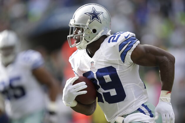 Dallas Cowboys running back DeMarco Murray runs in the first half of an NFL football game against the Seattle Seahawks, Sunday, Oct. 12, 2014, in Seattle. (AP Photo/Scott Eklund)