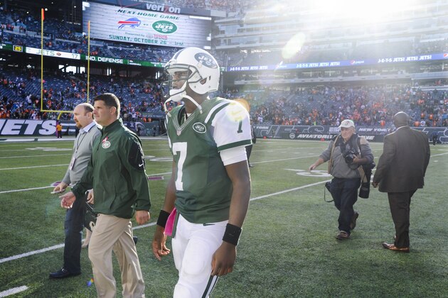 New York Jets quarterback Geno Smith (7) walks off the field after the Jets lost to the Denver Broncos 31-17 in an NFL football game, Sunday, Oct. 12, 2014, in East Rutherford, N.J. (AP Photo/Bill Kostroun) New York Jets quarterback Geno Smith (7) walks off the field after the Jets lost to the Denver Broncos 31-17 in an NFL football game, Sunday, Oct. 12, 2014, in East Rutherford, N.J. (AP Photo/Bill Kostroun)