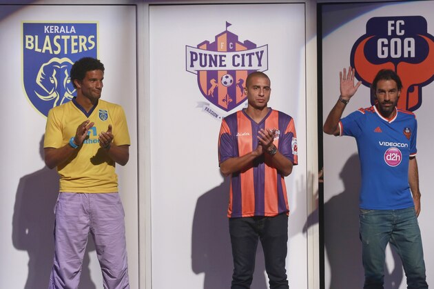 From left, Swedish footballer Fredrik Ljungberg who will play for the Mumbai team, English footballer David James, who will play for the Kerala Blasters team, French footballer David Trezeguet, who will play for the Pune team and French footballer Robert Pires who will play for the Goa team stand during the unveiling of the trophy of the inaugural Indian Super League (ISL) in Mumbai, India, Sunday, Oct. 5, 2014. The eight-team ISL kicks off on Oct.12. (Staffing/Rafiq Maqbool)