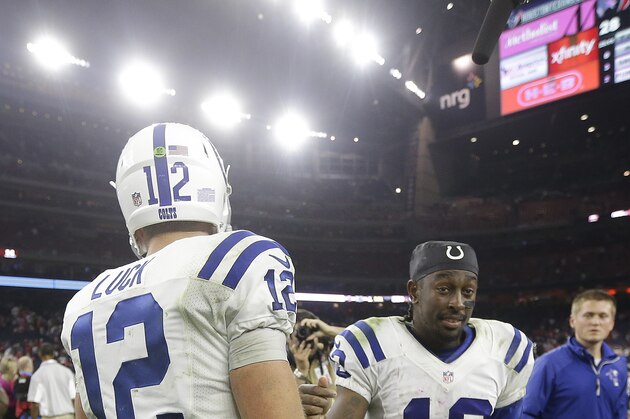 Indianapolis Colts wide receiver T.Y. Hilton (13) and quarterback Andrew Luck (12) meet on the field after an NFL football game, Thursday, Oct. 9, 2014, in Houston. (AP Photo/Patric Schneider)