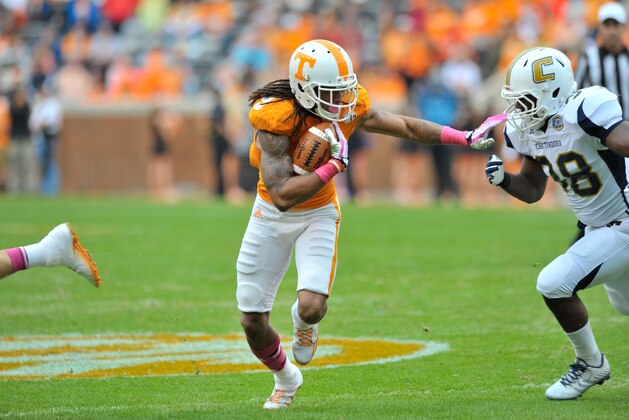 Oct 11, 2014; Knoxville, TN, USA; Tennessee Volunteers wide receiver Marquez North (8) rushes against Chattanooga Mocs linebacker Muhasibi Wakeel (38) during the first half at Neyland Stadium. Mandatory Credit: Jim Brown-USA TODAY Sports