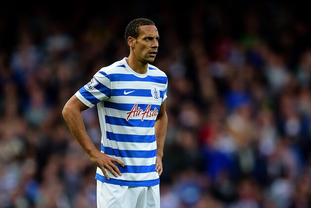 LONDON, ENGLAND - OCTOBER 05:  Rio Ferdinand of QPR reacts during the Barclays Premier League match between West Ham United and Queens Park Rangers at Boleyn Ground on October 5, 2014 in London, England.  (Photo by Jamie McDonald/Getty Images)