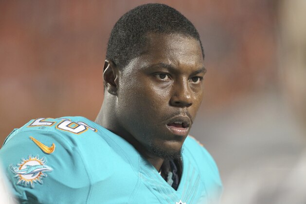 MIAMI GARDENS, FL - AUGUST 28:  Knowshon Moreno #28 of the Miami Dolphins looks on in the fourth quarter during action against the St. Louis Rams at Sun Life Stadium on August 28, 2014 in Miami Gardens, Florida.  (Photo by Marc Serota/Getty Images)