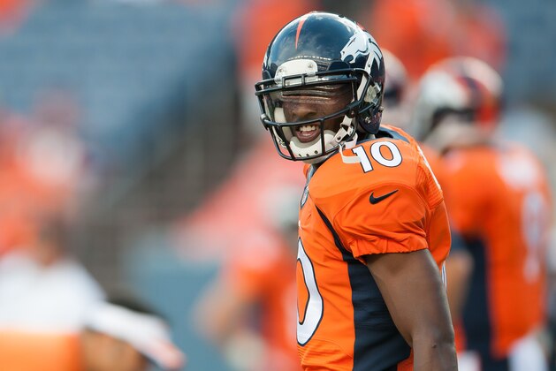 DENVER, CO - AUGUST 07:  Wide receiver Emmanuel Sanders #10 of the Denver Broncos walks the field before a preseason game against the Seattle Seahawks  at Sports Authority Field Field at Mile High on August 7, 2014 in Denver, Colorado.  (Photo by Dustin Bradford/Getty Images)