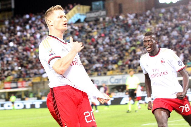 AC Milan defender Ignazio Abate celebrates after scoring during the Serie A soccer match between Bologna and Milan, at Bologna's Renato Dall'Ara stadium, Italy, Wednesday, Sept. 25, 2013. (AP Photo/Paolo Ferrari)