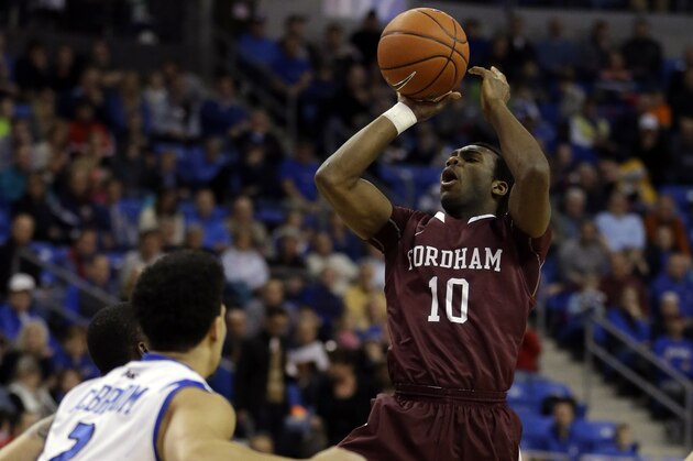 Fordham's Jon Severe (10) shoots over Saint Louis' Austin McBroom during the first half of an NCAA college basketball game Saturday, Jan. 18, 2014, in St. Louis. (AP Photo/Jeff Roberson)