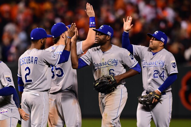 BALTIMORE, MD - OCTOBER 11:  Lorenzo Cain #6 of the Kansas City Royals celebrates with his teammates after defeating the Baltimore Orioles 6 to 4 in Game Two of the American League Championship Series at Oriole Park at Camden Yards on October 11, 2014 in Baltimore, Maryland.  (Photo by Patrick Smith/Getty Images)