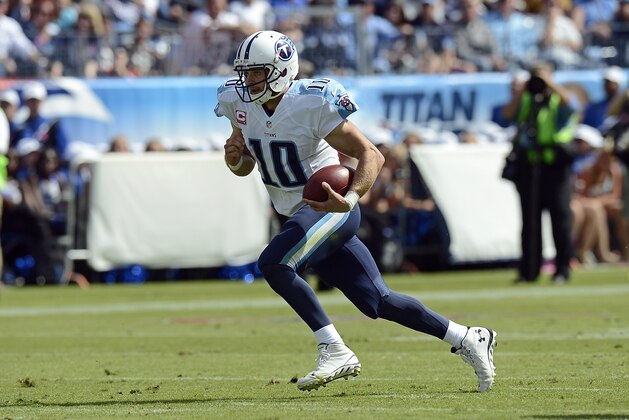 Tennessee Titans quarterback Jake Locker scrambles against the Cleveland Browns in the second quarter of an NFL football game Sunday, Oct. 5, 2014, in Nashville, Tenn. (AP Photo/Mark Zaleski)