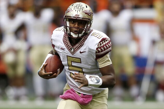 Florida State quarterback Jameis Winston (5) runs against Syracuse during the first half of an NCAA college football game on Saturday, Oct. 11, 2014, in Syracuse, N.Y. (AP Photo/Mike Groll)