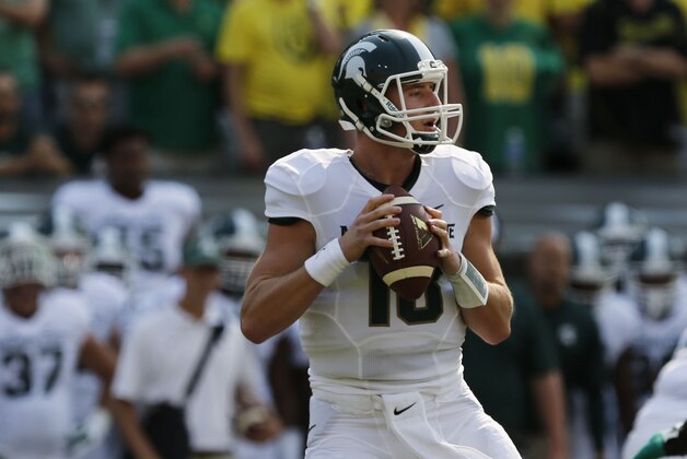 FILE - This Saturday, Sept. 6, 2014 file photo shows Michigan State's Connor Cook looking for an open receiver down field during the first quarter against the Oregon Ducks in a college football game in Eugene, Oregon. There aren’t many teams in the country that wouldn’t like a running back like Nebraska’s Ameer Abdullah or Wisconsin’s Melvin Gordon, or a smart, dangerous quarterback such as Christian Hackenberg of Penn State or Michigan State’s Cook.(AP Photo/Chris Pietsch, File)