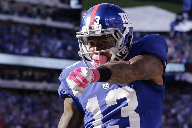 New York Giants wide receiver Odell Beckham celebrates after scoring on a touchdown pass from quarterback Eli Manning during the second half of an NFL football game, Sunday, Oct. 5, 2014, in East Rutherford, N.J. (AP Photo/Seth Wenig)