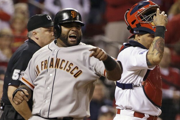 San Francisco Giants' Pablo Sandoval reacts in front of St. Louis Cardinals catcher Yadier Molina as he scores on a single by Hunter Pence during the sixth inning in Game 2 of the National League baseball championship series Sunday, Oct. 12, 2014, in St. Louis. (AP Photo/David J. Phillip)