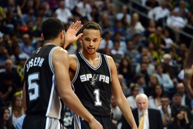 ISTANBUL, TURKEY - OCTOBER 11: Kyle Anderson #1 and Cory Joseph #5 of the San Antonio Spurs high five each other against Fenerbahce Ulker during a game as part of the NBA Global Games on October 11, 2014 at the Ulker Sports Arena in Istanbul, Turkey. NOTE TO USER: User expressly acknowledges and agrees that, by downloading and or using this Photograph, user is consenting to the terms and conditions of the Getty Images License Agreement. Mandatory Copyright Notice: Copyright 2014 NBAE (Photo by Garrett Ellwood/NBAE via Getty Images)