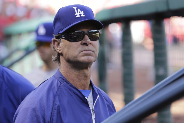 Los Angeles Dodgers manager Don Mattingly stands in the dugout before Game 4 of baseball's NL Division Series against the St. Louis Cardinals, Tuesday, Oct. 7, 2014, in St. Louis. (AP Photo/Charles Rex Arbogast)