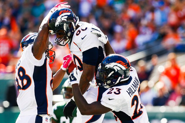 EAST RUTHERFORD, NJ - OCTOBER 12: Demaryius Thomas #88 and Ronnie Hillman #23 celebrate with Julius Thomas #80 of the Denver Broncos after a touchdown in the second quarter during a game against the New York Jets at MetLife Stadium on October 12, 2014 in East Rutherford, New Jersey.  (Photo by Jeff Zelevansky/Getty Images)