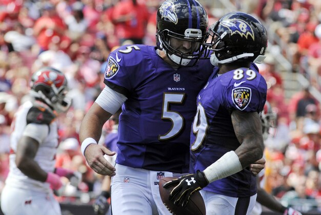 Oct 12, 2014; Tampa, FL, USA; Baltimore Ravens quarterback Joe Flacco (5) celebrates a touchdown pass of the first half with wide receiver Steve Smith (89) against the Tampa Bay Buccaneers at Raymond James Stadium. Mandatory Credit: David Manning-USA TODAY Sports