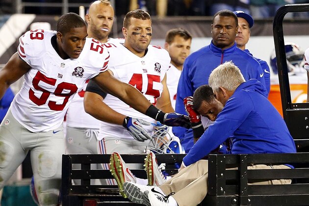 PHILADELPHIA, PA - OCTOBER 12: Victor Cruz #80 of the New York Giants is carted off the field after attempting a catch in the end zone during the third quarter of a football game at Lincoln Financial Field on October 12, 2014 in Philadelphia, Pennsylvania. The eagles defeated the Giants 27-0. (Photo by Rich Schultz /Getty Images)