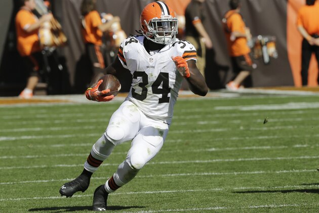 Cleveland Browns running back Isaiah Crowell (34) runs against the Baltimore Ravens in the third quarter of an NFL football game Sunday, Sept. 21, 2014, in Cleveland. (AP Photo/Tony Dejak)