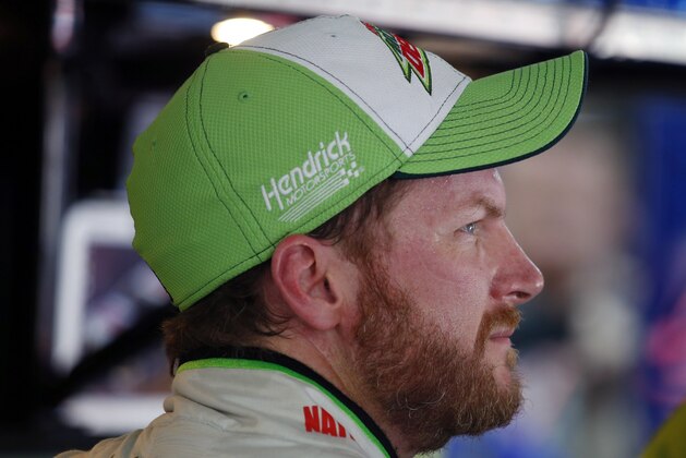 Dale Earnhardt Jr. looks out of the garage during practice for Saturday's NASCAR Bank of America Sprint Cup series auto race at Charlotte Motor Speedway in Concord, N.C., Friday, Oct. 10, 2014. (AP Photo/Chris Keane)