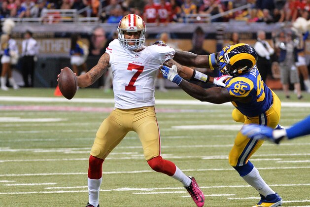 ST LOUIS, MO - OCTOBER 13:   Colin Kaepernick #7 of the San Francisco 49ers is tackled by  William Hayes #95 of the St. Louis Rams in the fourth quarter of at Edward Jones Dome on October 13, 2014 in St Louis, Missouri.  (Photo by Michael Thomas/Getty Images)