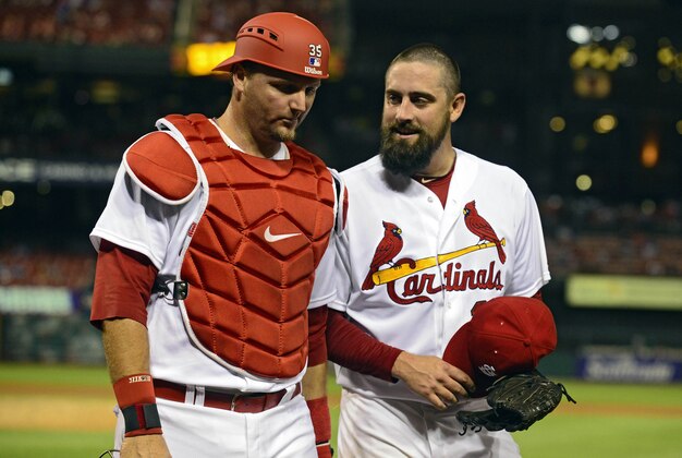 Aug 19, 2014; St. Louis, MO, USA; St. Louis Cardinals relief pitcher Pat Neshek (37) talks with catcher A.J. Pierzynski (35) after the ninth inning against the Cincinnati Reds at Busch Stadium. The Cardinals defeated the Reds 5-4. Mandatory Credit: Jeff Curry-USA TODAY Sports