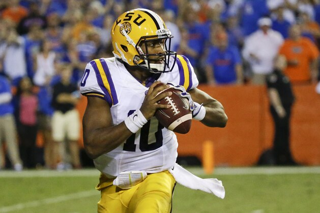 LSU quarterback Anthony Jennings looks for a receiver during the second half of an NCAA college football game against Florida in Gainesville, Fla., Saturday, Oct. 11, 2014. LSU won the game 30-27. (AP Photo/John Raoux)
