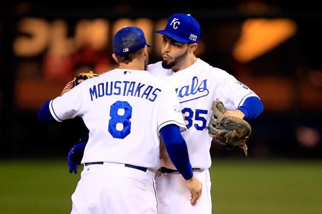 KANSAS CITY, MO - OCTOBER 14:  Eric Hosmer #35 celebrates with Mike Moustakas #8 of the Kansas City Royals after defeating the Baltimore Orioles 2 to 1 in Game Three of the American League Championship Series at Kauffman Stadium on October 14, 2014 in Kansas City, Missouri.  (Photo by Jamie Squire/Getty Images)