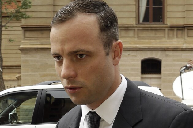 Oscar Pistorius arrives for his mitigation of sentencing at the high court in Pretoria, South Africa, Wednesday, Oct. 15, 2014. Pistorius faces sentencing this week in the South African court after being convicted of culpable homicide for killing girlfriend Reeva Steenkamp. (AP Photo/Themba Hadebe)