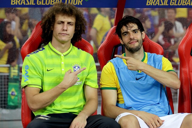 SINGAPORE - OCTOBER 14: (L-R) David Luiz and Kaka of Brazil gesture on the team bench during the international friendly match between Japan and Brazil at the National Stadium on October 14, 2014 in Singapore.  (Photo by Suhaimi Abdullah/Getty Images)