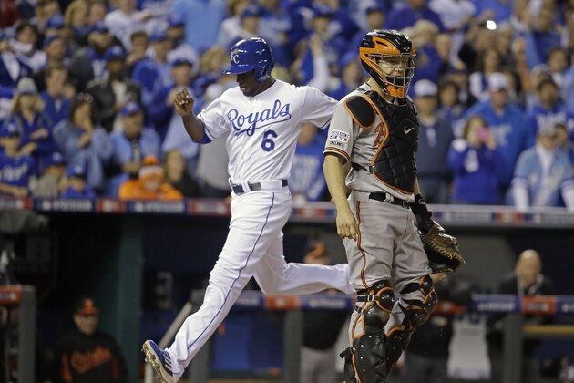 Kansas City Royals' Lorenzo Cain (6) scores on a ground out by Alex Gordon during the fourth inning of Game 3 of the American League baseball championship series against the Baltimore Orioles Tuesday, Oct. 14, 2014, in Kansas City, Mo. (AP Photo/Charlie Riedel)