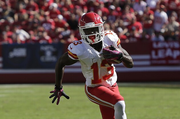 Kansas City Chiefs running back De'Anthony Thomas (13) runs against the San Francisco 49ers during the second half of an NFL football game in Santa Clara, Calif., Sunday, Oct. 5, 2014. (AP Photo/Marcio Jose Sanchez)