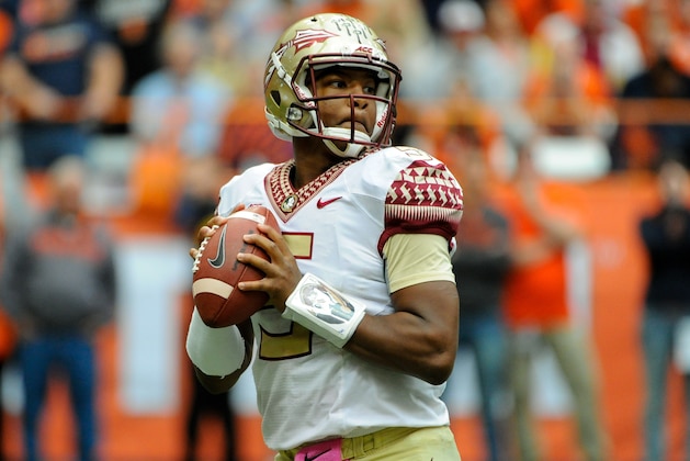 Oct 11, 2014; Syracuse, NY, USA; Florida State Seminoles quarterback Jameis Winston (5) drops back to pass against the Syracuse Orange during the third quarter at the Carrier Dome.  Florida State defeated Syracuse 38-20.  Mandatory Credit: Rich Barnes-USA TODAY Sports