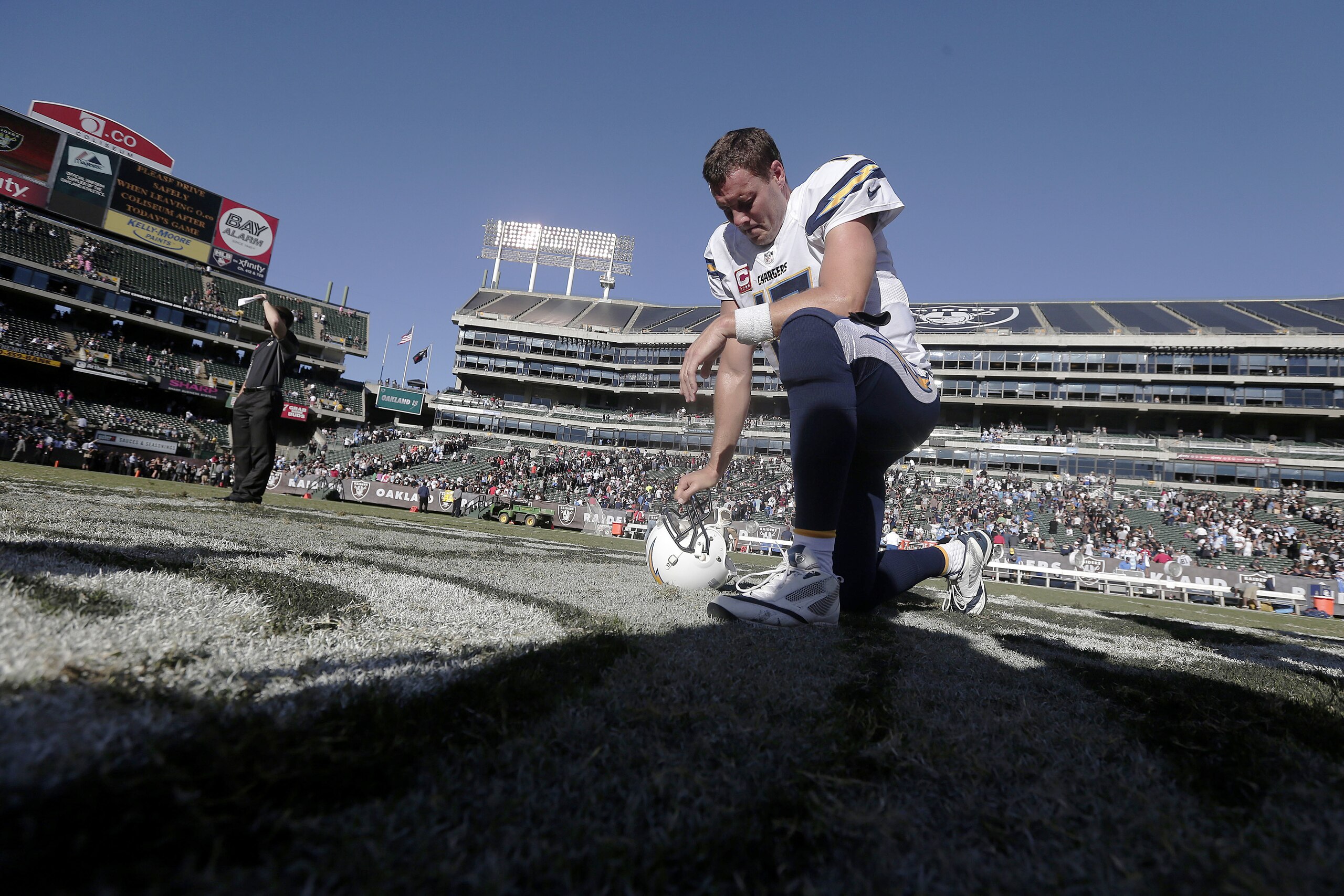 San Diego Chargers quarterback Philip Rivers (17) kneels on the field after the Chargers defeated the Oakland Raiders 31-28 in an NFL football game in Oakland, Calif., Sunday, Oct. 12, 2014. (AP Photo/Marcio Jose Sanchez) San Diego Chargers quarterback Philip Rivers (17) kneels on the field after the Chargers defeated the Oakland Raiders 31-28 in an NFL football game in Oakland, Calif., Sunday, Oct. 12, 2014. (AP Photo/Marcio Jose Sanchez)