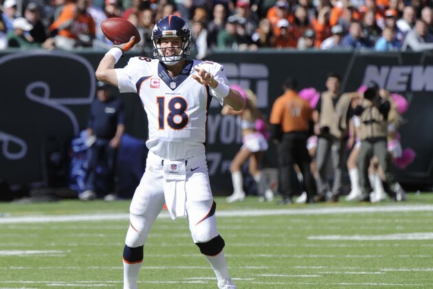 Denver Broncos quarterback Peyton Manning (18) throws against the New York Jets in the first quarter of an NFL football game, Sunday, Oct. 12, 2014, in East Rutherford, N.J. (AP Photo/Bill Kostroun)
