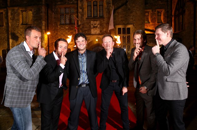 ASH, ENGLAND - OCTOBER 14:  Ryder Cup stars (L-R) Henrik Stenson of Sweden, Graeme McDowell of Northern Ireland, Patrick Reed of the USA,Jamie Donaldson of Wales, Victor Dubuisson of France and Stephen Gallacher of Scotland jokingly tell Reed to be quiet at the Welcome Dinner at Eastwell Manor prior to the start of the Volvo World Match Play Championship at The London Club on October 14, 2014 in Ash, United Kingdom.  (Photo by Richard Heathcote/Getty Images)