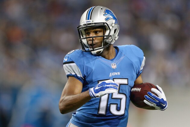 DETROIT, MI - AUGUST 22: Golden Tate #15 of the Detroit Lions look for running room up field in first quarter while playing Jacksonville Jaguars during a preseason game at Ford Field on August 22, 2014 in Detroit, Michigan. (Photo by Leon Halip/Getty Images)