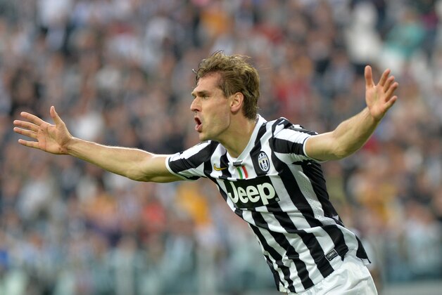 Juventus forward Fernando Llorente, of Spain, celebrates after scoring during a Serie A soccer match between Juventus and Livorno at the Juventus stadium, in Turin, Italy, Monday, April 7, 2014. (AP Photo/Massimo Pinca)
