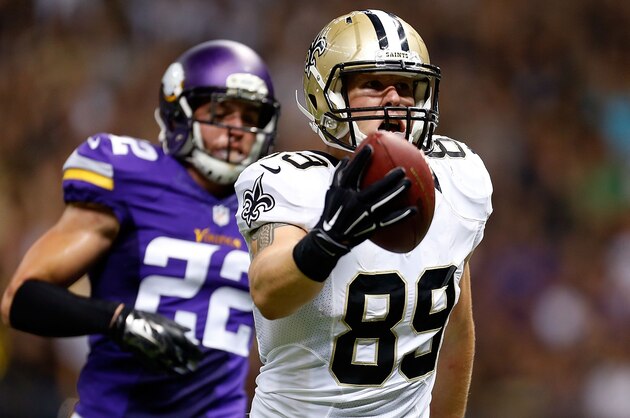NEW ORLEANS, LA - SEPTEMBER 21:  Josh Hill #89 of the New Orleans Saints scores a touchdown in front of Harrison Smith #22 of the Minnesota Vikings during the first quarter of a game at the Mercedes-Benz Superdome on September 21, 2014 in New Orleans, Louisiana.  (Photo by Wesley Hitt/Getty Images)