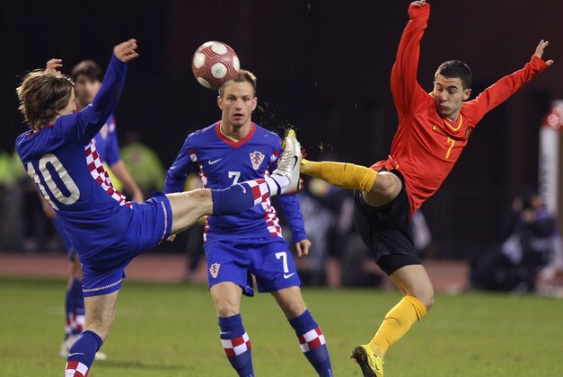 Belgium's Eden Hazard, right, challenges Croatia's Luka Modric, left, and Ivan Rakitic during their friendly soccer match at the King Baudouin stadium in Brussels, Wednesday March 3, 2010. (AP Photo/Geert Vanden Wijngaert)