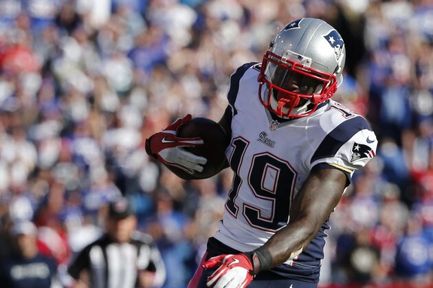 New England Patriots wide receiver Brandon LaFell (19) runs for a touchdown after breaking a tackle by Buffalo Bills' Leodis McKelvin (21) during the second half of an NFL football game Sunday, Oct. 12, 2014, in Orchard Park, N.Y. (AP Photo/Mike Groll)