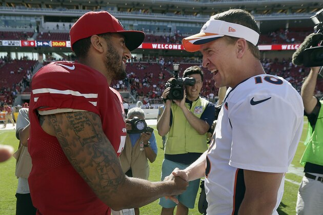 San Francisco 49ers quarterback Colin Kaepernick, left, shakes hands with Denver Broncos quarterback Peyton Manning after an NFL preseason football game in Santa Clara, Calif., Sunday, Aug. 17, 2014. The Broncos won 34-0. (AP Photo/Marcio Jose Sanchez)