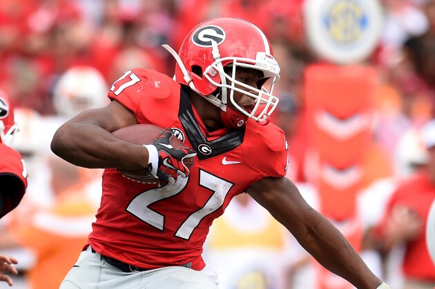 Sep 27, 2014; Athens, GA, USA; Georgia Bulldogs running back Nick Chubb (27) runs with the ball against the Tennessee Volunteers during the second half at Sanford Stadium. Georgia defeated Tennessee 35-32. Mandatory Credit: Dale Zanine-USA TODAY Sports