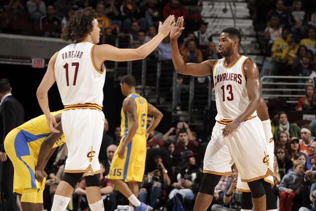 CLEVELAND, OH - OCTOBER 5:  Anderson Varejao #17 of the Cleveland Cavaliers high fives teammate Tristan Thompson #13 of the Cleveland Cavaliers during the game against Maccabi Tel Aviv at The Quicken Loans Arena on October 16, 2014 in Cleveland, Ohio. NOTE TO USER: User expressly acknowledges and agrees that, by downloading and/or using this Photograph, user is consenting to the terms and conditions of the Getty Images License Agreement. Mandatory Copyright Notice: Copyright 2014 NBAE (Photo by David Liam Kyle/NBAE via Getty Images)
