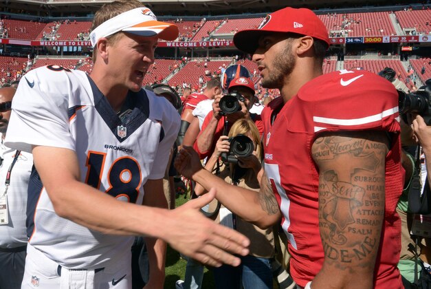 Aug 17, 2014; Santa Clara, CA, USA; Denver Broncos quarterback Peyton Manning (18) and San Francisco 49ers quarterback Colin Kaepernick (7) shake hands after the inaugural football game at Levi's Stadium. The Broncos defeated the 49ers 34-0. Mandatory Credit: Kirby Lee-USA TODAY Sports