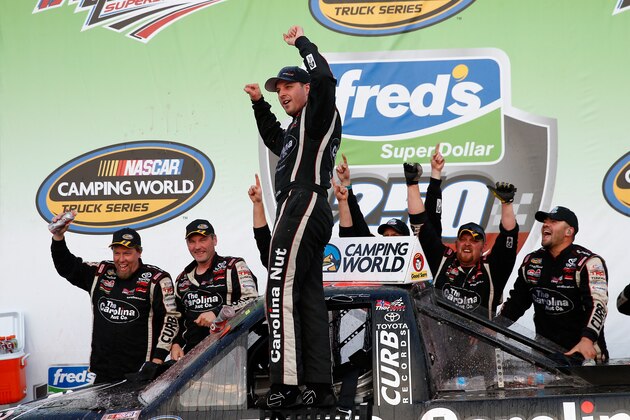 TALLADEGA, AL - OCTOBER 19:  Johnny Sauter, driver of the #98 Carolina Nut / Curb Records Toyota, celebrates in Victory Lane after winning the Camping World Truck Series Fred's 250 Powered By Coca-Cola at Talladega Superspeedway on October 19, 2013 in Talladega, Alabama.  (Photo by Chris Graythen/Getty Images)
