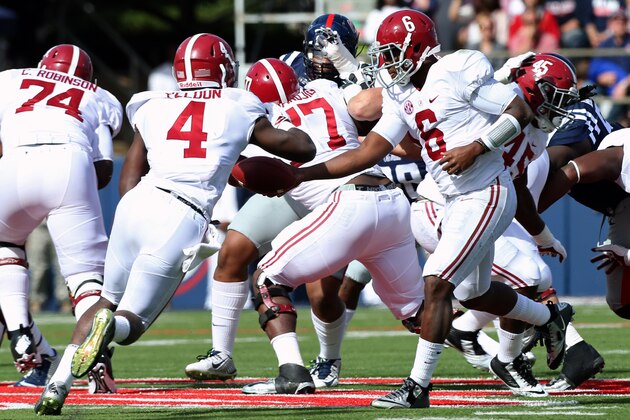 OXFORD, MS - OCTOBER 4: Blake Sims #6 of the Alabama Crimson Tide hands off the ball to T.J. Yeldon #4 of the Alabama Crimson Tide against the Ole Miss Rebels on October 4, 2014 at Vaught-Hemingway Stadium in Oxford, Mississippi.  (Photo by Joe Murphy/Getty Images)