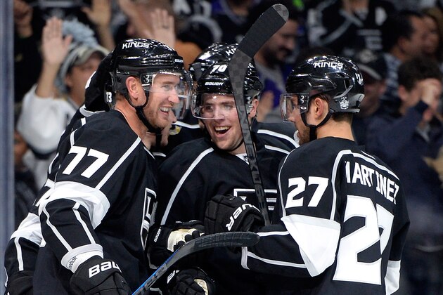 LOS ANGELES, CA - OCTOBER 12:  Tanner Pearson #70 of the Los Angeles Kings celebrates his goal with Jeff Carter #77 and Alec Martinez #27 of the Los Angeles Kings to take a 3-0 lead over the Winnipeg Jets at Staples Center on October 12, 2014 in Los Angeles, California.  (Photo by Harry How/Getty Images)